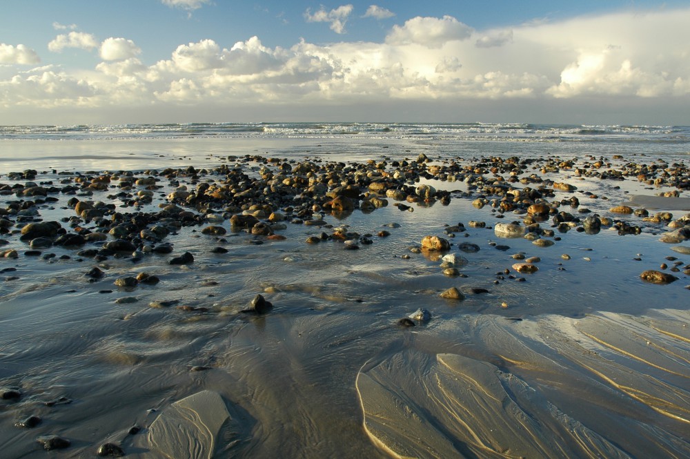 La Baie de Somme - La mer se retire laissant apparaître un champ de galets